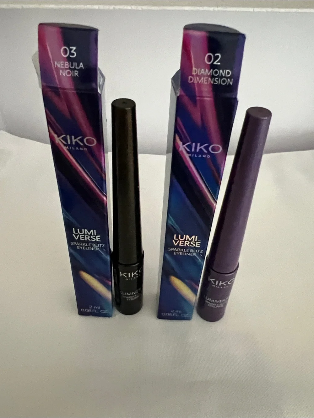 Kiko Lumiverse:Sparkle Blitz Eyeliner in 02 Diamond Dimension and 03 Nebula Noir